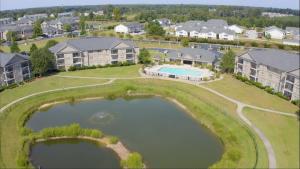 Apartment Rentals in Fayetteville, NC - Aerial View of Community Exteriors with Pond and Walking Trail